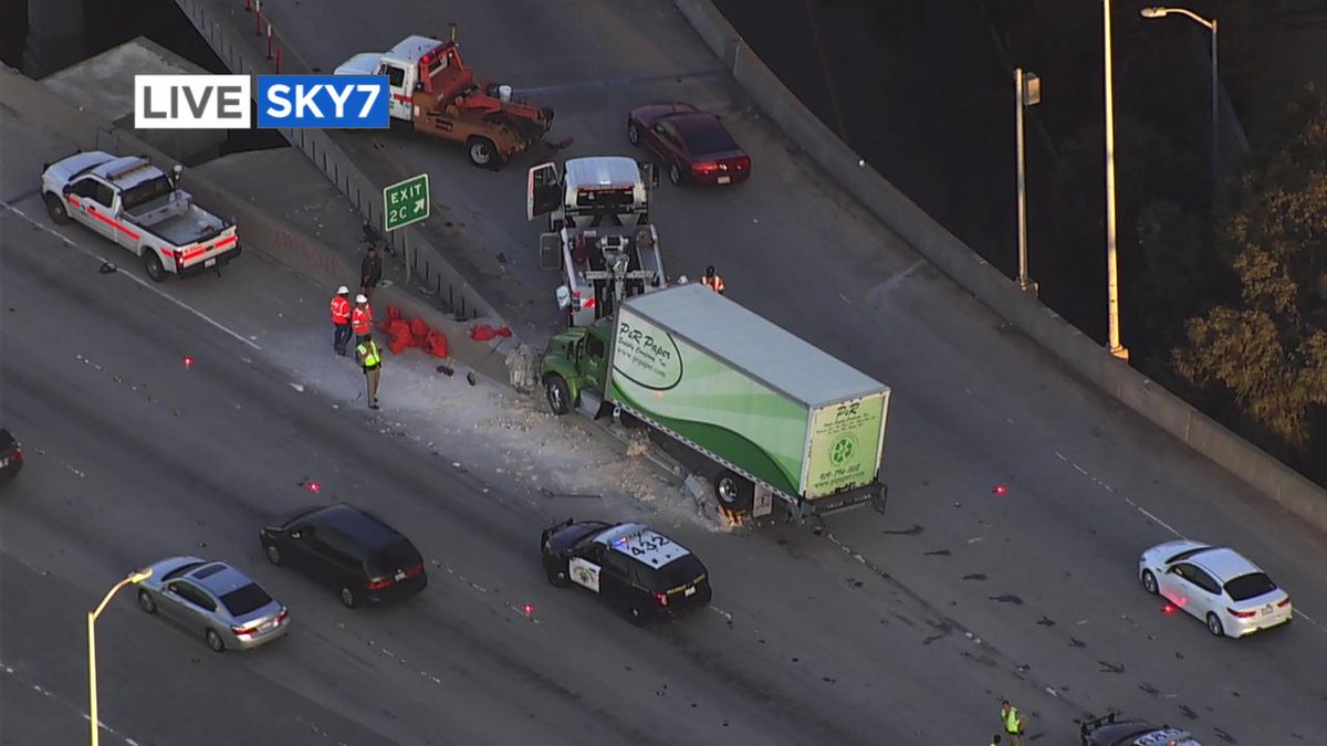 Sky7 over long term problem WB 80 on Bay Bridge at Fremont exit - box truck hit barrier, right lane blocked on main line, left lane of exit blocked.
