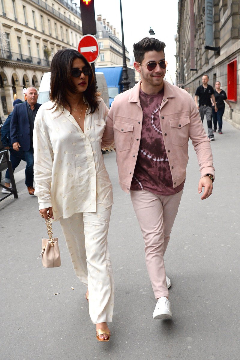 victoriabeckham's tweet photo. .#SophieTurner and #PriyankaChopra in the #VBPreAW19 pyjama set. Discover at https://t.co/Ukr2cRgFur https://t.co/N1b2DkJuiT