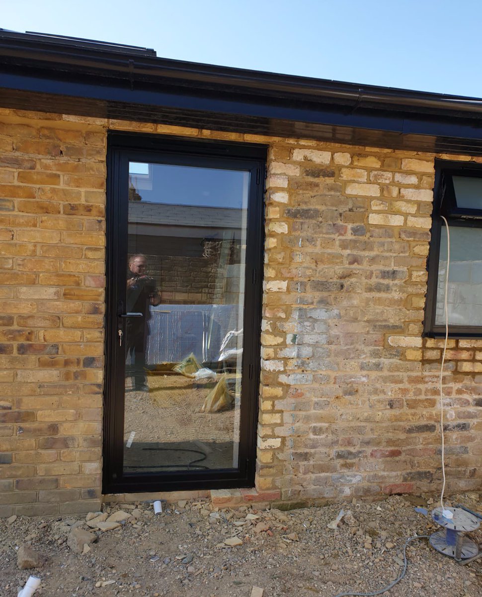 Love the contrast of our black aluminium frames and sliding doors on yellow brickwork at this barn conversion near Richmond-on-Thames in London.  #london #black #aluminiumdoors #Richmondonthames #Slidingdoors #homeinspo #Design #interior #glazing #teamwork #windowfitters