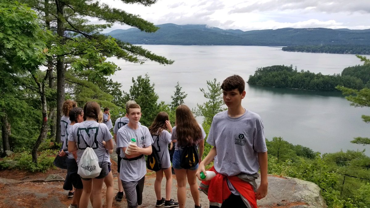 Incoming freshman taking in the views of Newfound Lake from Little Sugarloaf during a Bridge Academy session.
