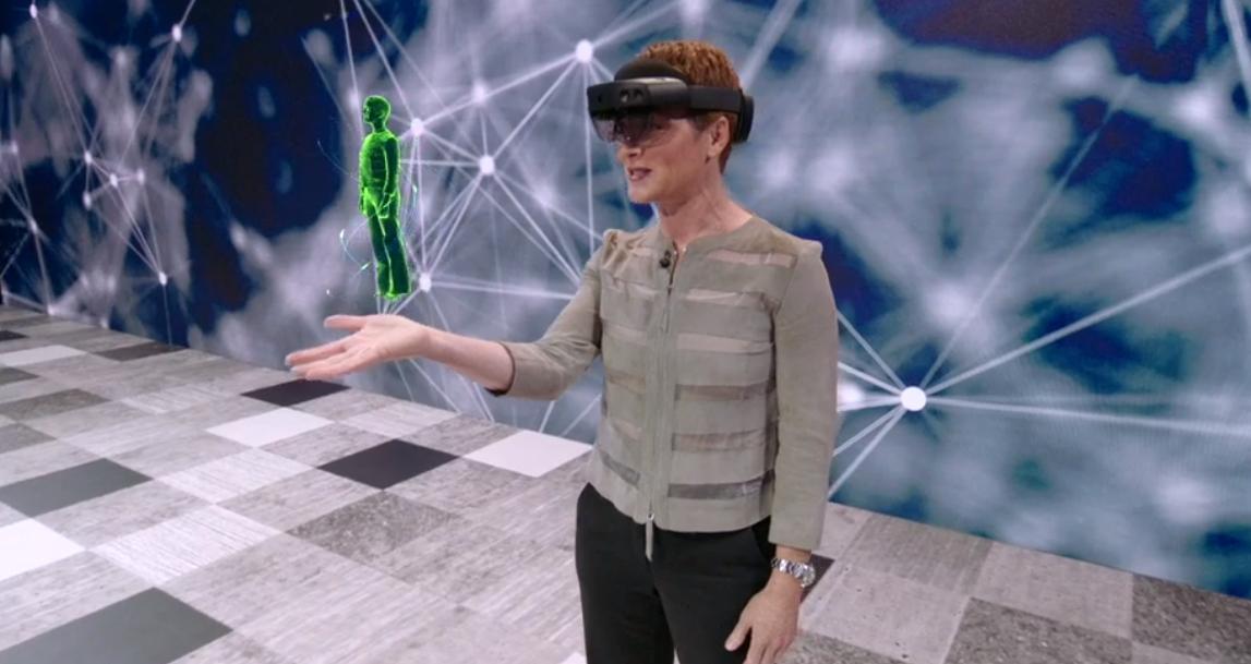 Microsoft's tweet image. .@JulWhite shows how technology and holographic experiences can break down language barriers on the #MSInspire stage.