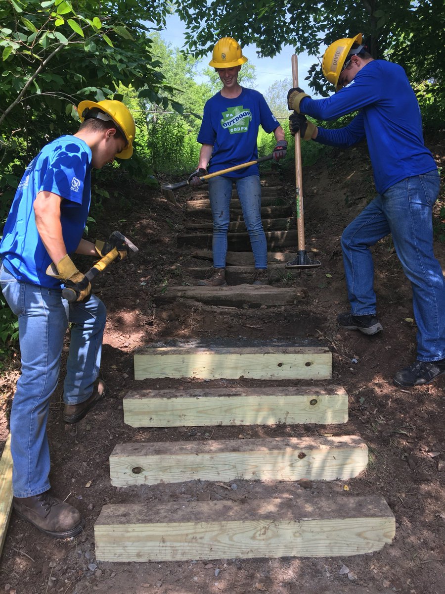 DCNRnews's tweet photo. DCNR Secretary Cindy Adams Dunn and Deputy Secretary John Norbeck visit with members of the #PAOutdoorCorps Wilkes-Barre summer crew while they were working on repairs to the #HawkFallsTrail at #HickoryRunStatePark. #PAProud https://t.co/2IIkuf6ceF