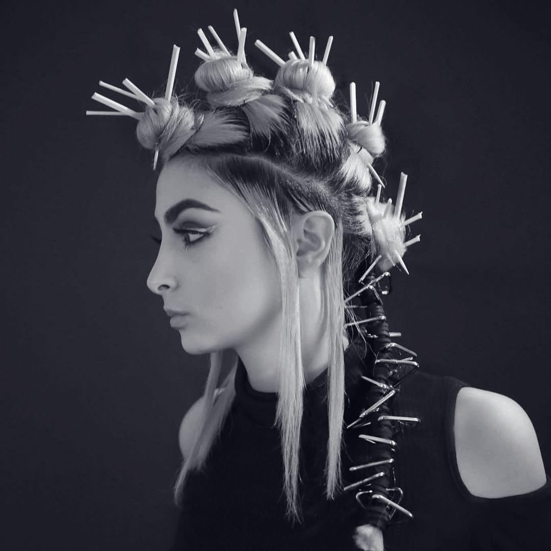 What’s your favorite #hairaccessory to incorporate into a style? ⚡️ #peter_potrus added chop sticks into the top knots of this elaborate design. He wrapped the ponytail in leather and embellished with metal triangles. #IAMWHATSNEXT #ShapeYourWorld