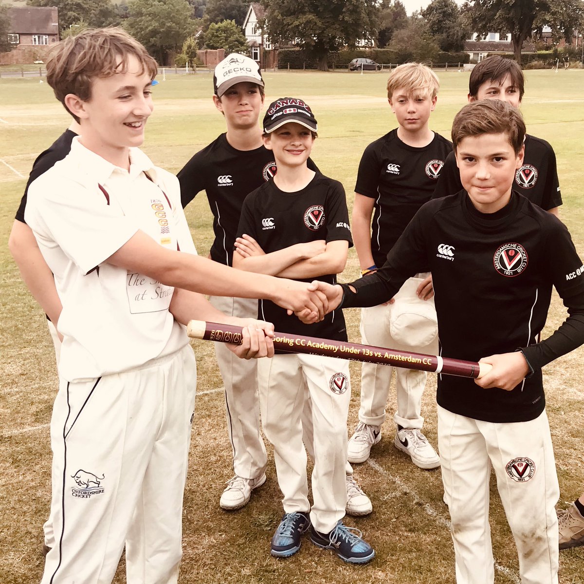 GCCAcademy's tweet photo. Tonight the Under 13s played their first ‘international’ against Amsterdam CC. Here’s our captain presenting a commemorative stump to the ACC Skipper.  @Upswinger @GoringStreatley https://t.co/8eEd97Ufrb