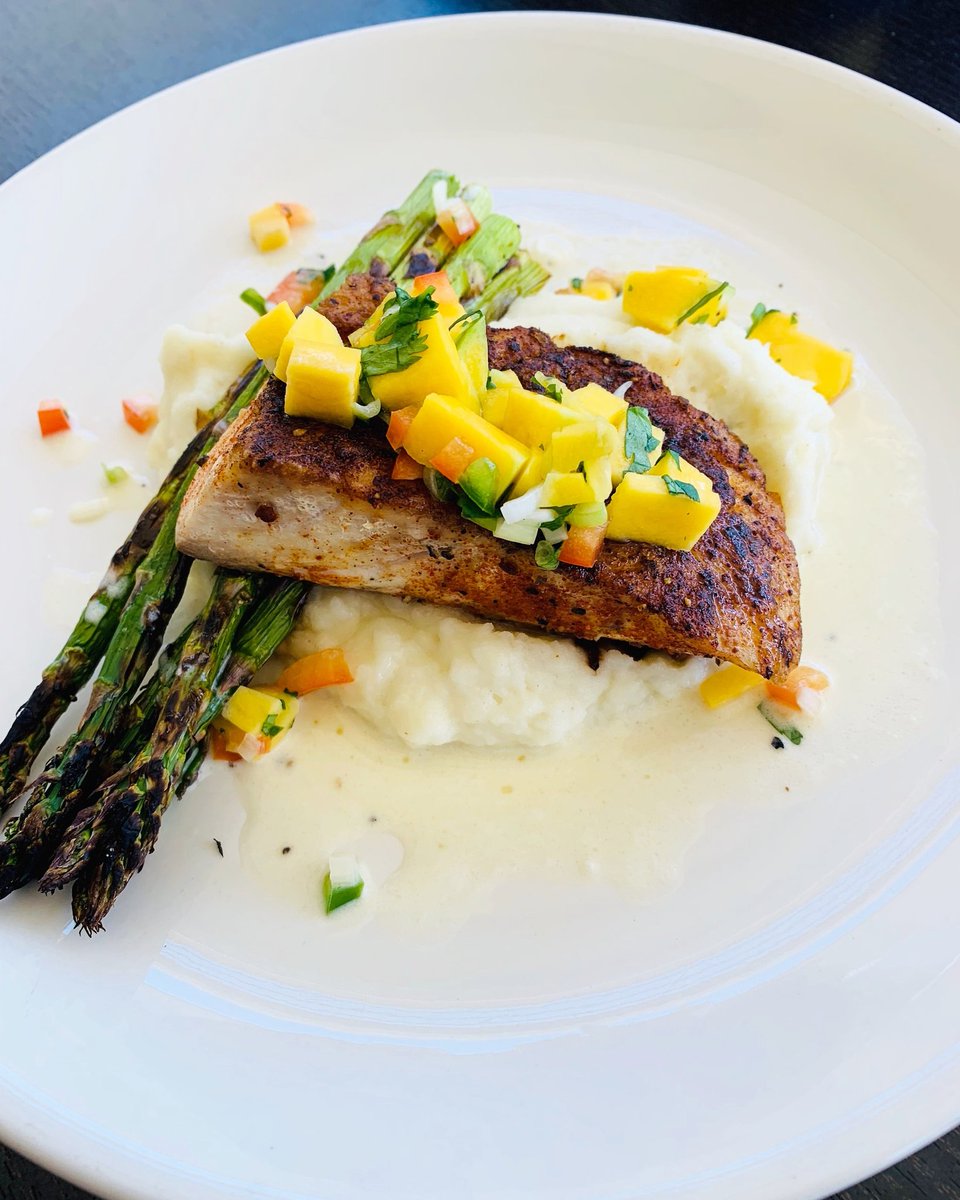 Our Special Tonight 🥳 Blackened Seabass on mashed potatoes, grilled asparagus and topped with Mango Salsa! Come and get it