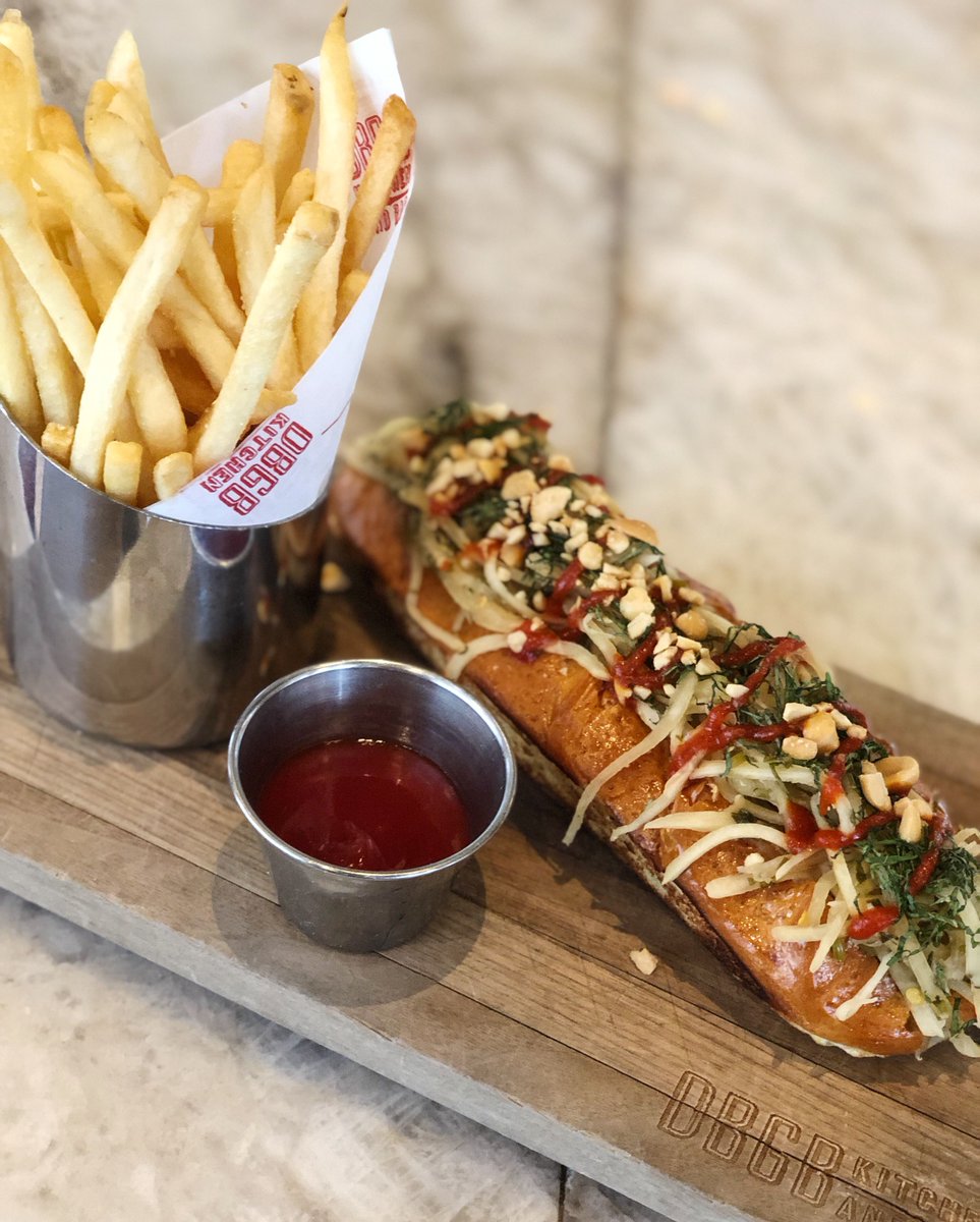 #NationalHotDogDay has us hankering for our Thai Sausage on a bun. Gather around our marble bar or outdoor terrace for #happyhour from 3-6 p.m. and partake!