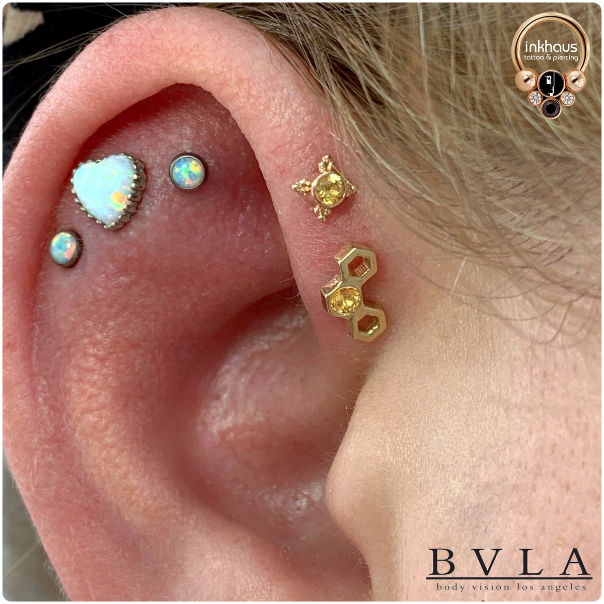 How’s this for a jewellery make-over? 😍 This client wanted to go for a new bee theme, so we changed her forward helix piercings to a stunning honeycomb piece from <a href="/BODYVISIONLA/">BVLA</a> with a honey topaz gemstone and a ‘mini kandy’ (also from BVLA) that also features a honey topaz gem.