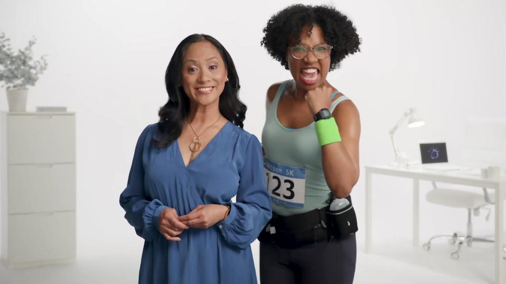 2 women, one in running gear