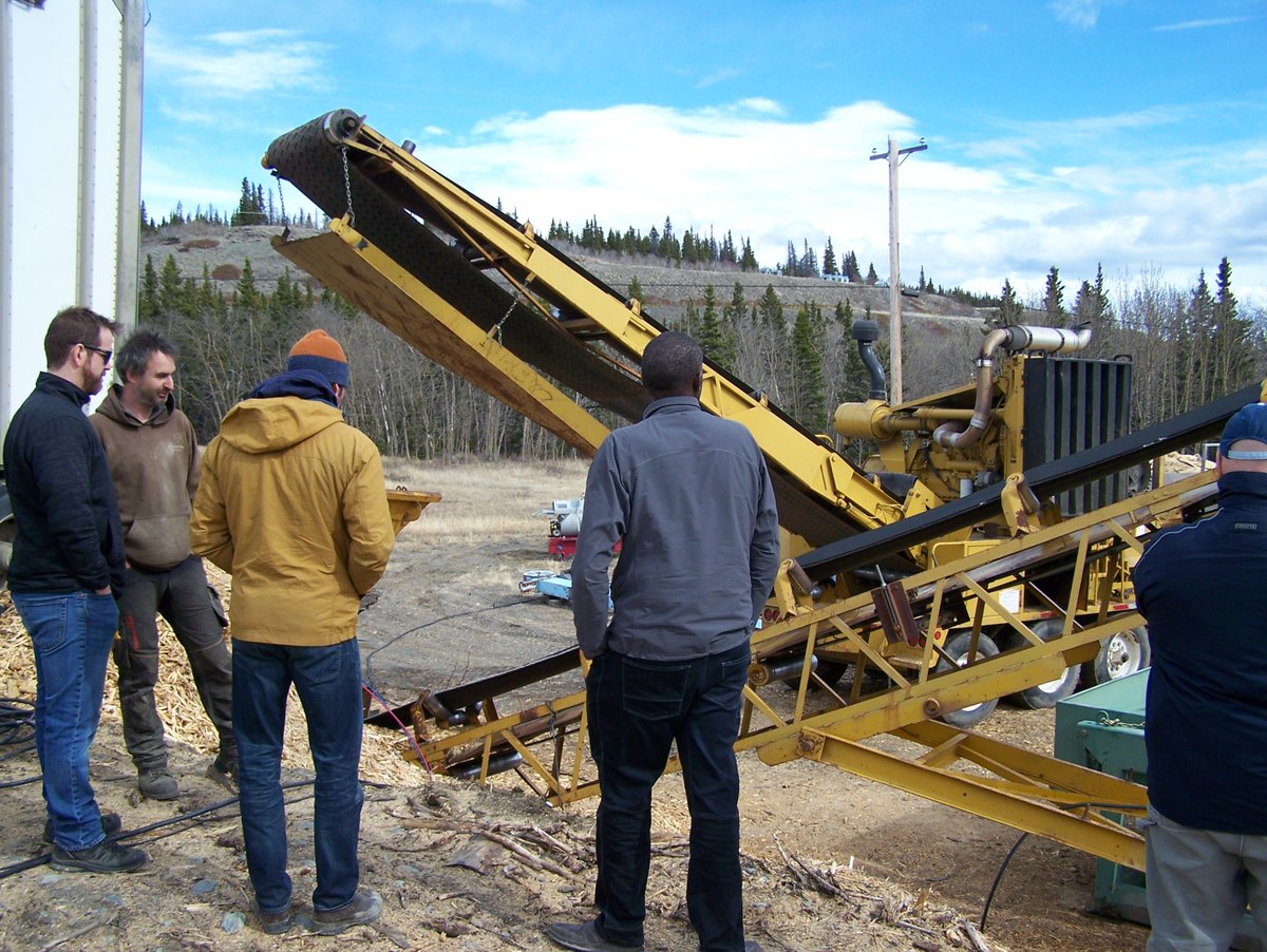 EMRYukon's tweet photo. #TBT This spring, First Nation partners and energy advisors toured Yukon-based, operational #biomass facilities. Bear Creek Logging in Haines Junction turns waste/slash pile wood into chips to fuel biomass burners. Check out the chipper! #RenewableEnergy https://t.co/fGSeJPhCdD https://t.co/So7iyogsZd