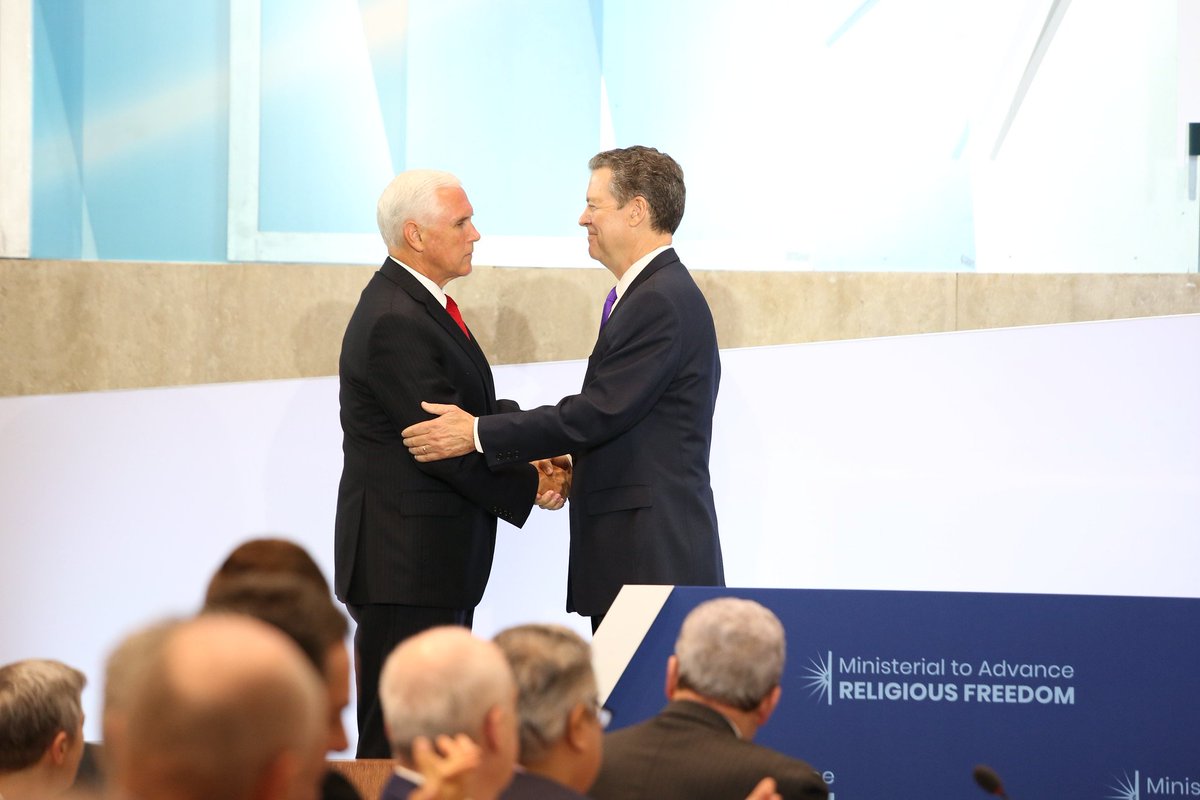 U.S. Vice President Pence shakes hands with Ambassador at Large for Religious Freedom Sam Brownback at the 2019 Ministerial to Advance Religious Freedom at the U.S. Department of State