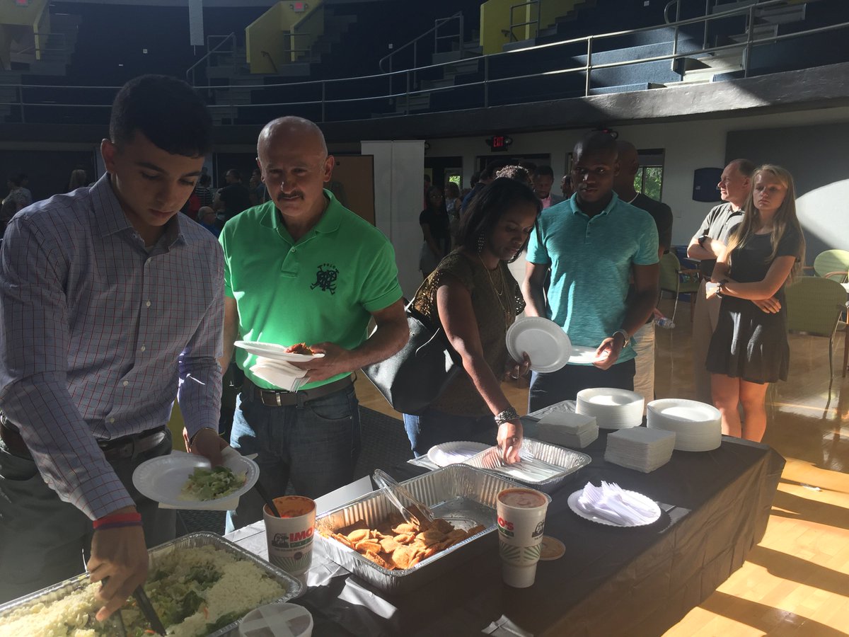 OptimistOrg's tweet photo. Our #OptimistOratorical competitors arrived tonight with nervous smiles, but luckily pizza is the universal comfort food. Hereβs a peek at registration night. Best of luck, everyone! https://t.co/5hSP9FYdZf