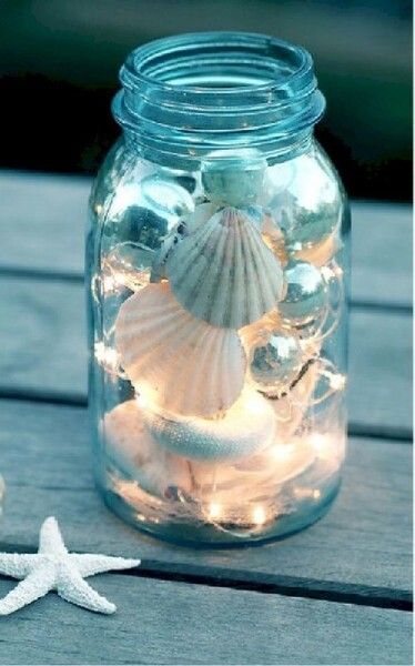 Bring a little bit of the beach to your home with this DIY mermaid candle idea which doubles the fun you and your guests will love... #OutdoorLivingSpaces #DIY #Crafts #CoastalTheme #BeachVibe #JamJar #DoItYourself #RecycledItems #HandyMan #Productivity #Creativity #Craftiness
