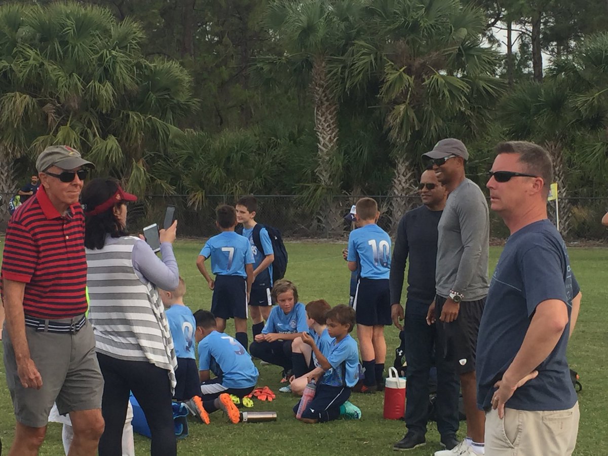 LaurenceReisman's tweet photo. .@TigerWoods poses for pictures after watching his son’s soccer game @IRSAHobart @TCPalm https://t.co/sJPDVs6AnB