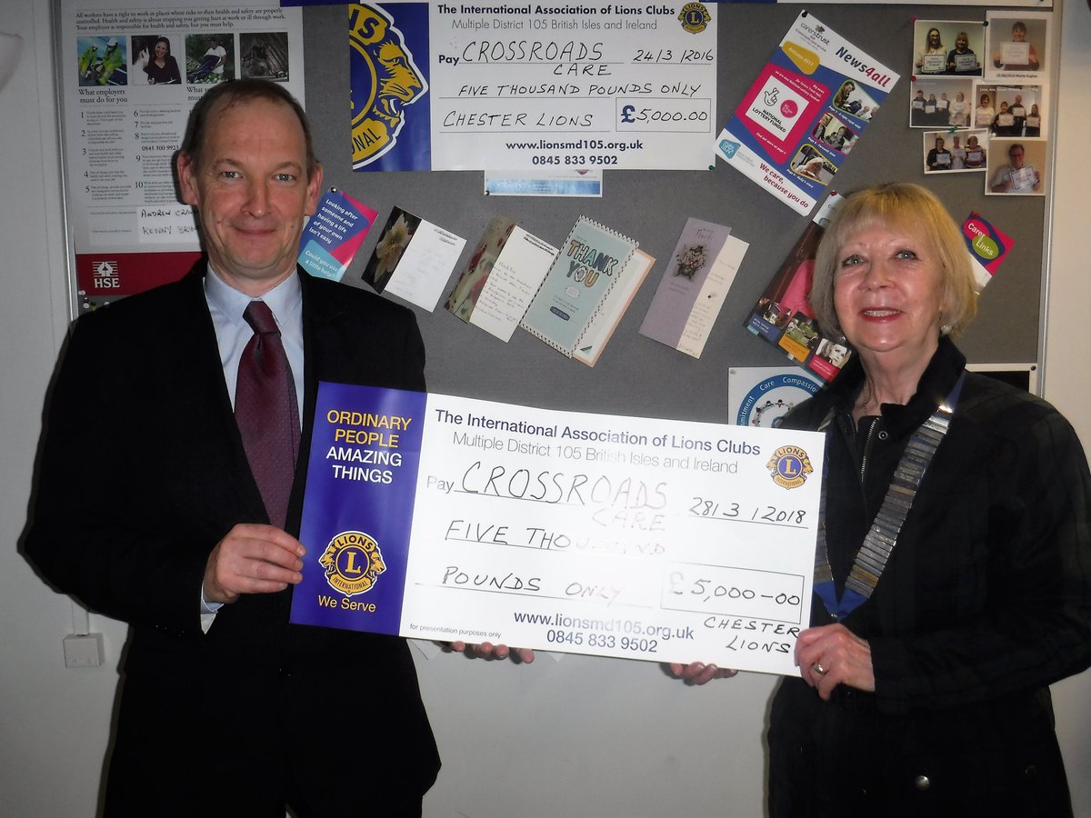 President Grace Brown of Chester Lions Club presents a cheque for £5000 to Andy Craven of carerstrust4all for their Crossroads care service . The money will provide 400 hours of vital respite breaks for carers , who care for loved ones with dementia in the Chester area.