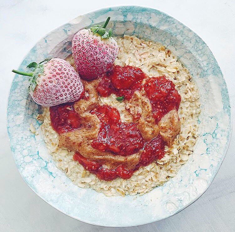 Simple #Sunday #porridge with strawberry #chiajam and Perfect #nutbutter - super satisfying and totally delicious #filledwithfeelgood.