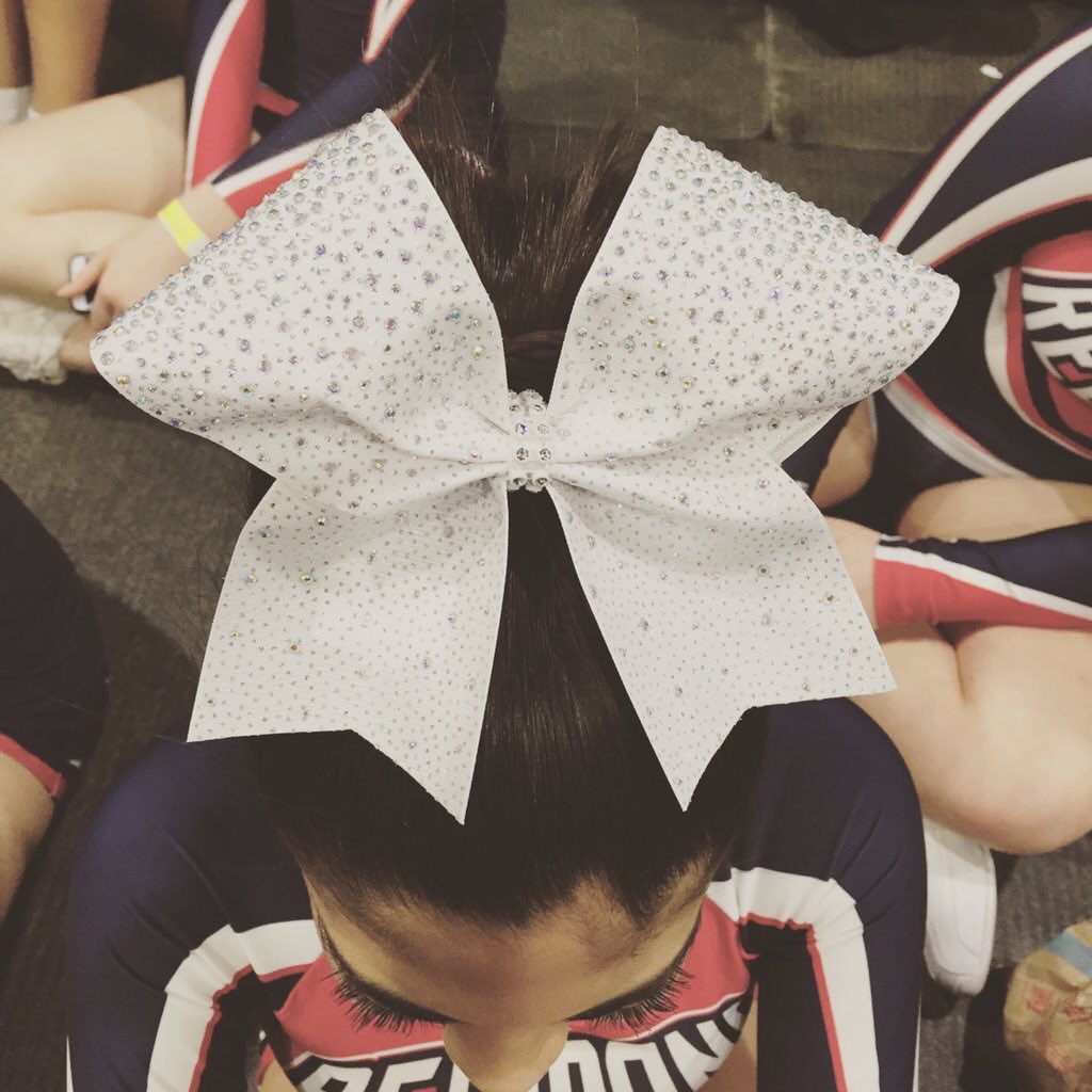 FJRcheer's tweet photo. The power of this bow is REAL! White with a touch of iridescent sparkle! Thankyou @lolocheerbows ! You’ve been our secret weapon since 2012! #TeamLolo #Cheerbows #Finals @OntarioCheer #OCFnationals https://t.co/a64RFKCf8f