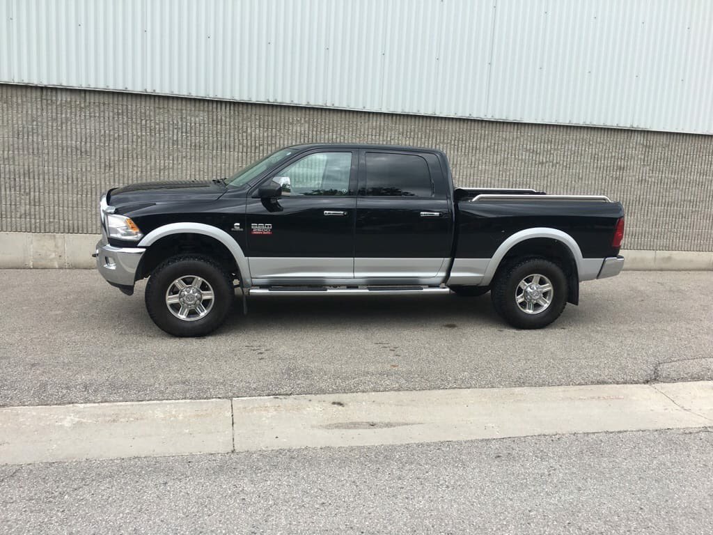 cajuniac's tweet photo. This is my brothers truck. It was stolen last night. It’s a 2500 Dodge 2012 Diesel Laramie black and silver. Last see between Kinkora and Monkton. If u see it let me know. https://t.co/hVy8g3Cs4k