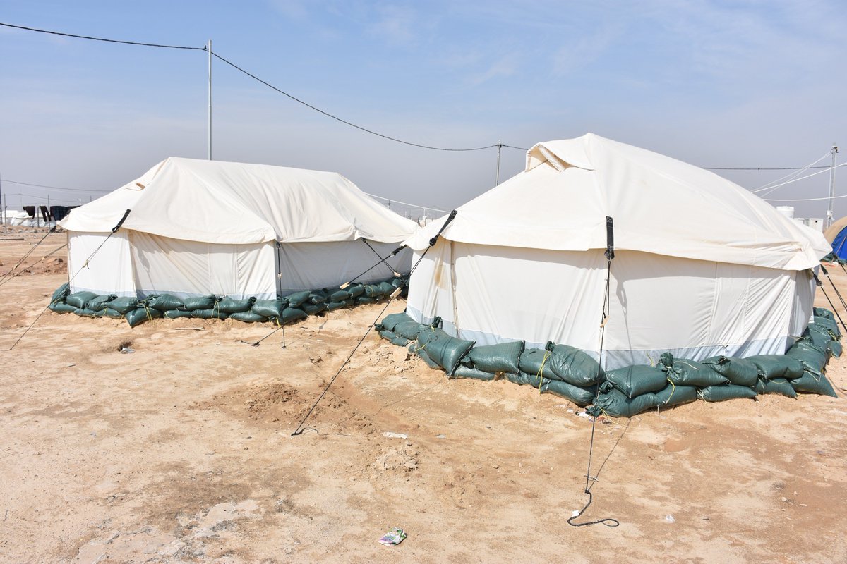 IOMIraq's tweet photo. “Because of constant shelling, we displaced from our home in Karabla sub-district to Camp Kilo18 in #AlAnbar looking for safety. The sandbags placed around our tent and in the camp help to minimize the risk of #flooding,” said Saif, 18 years old. https://t.co/fqWekk87Lw