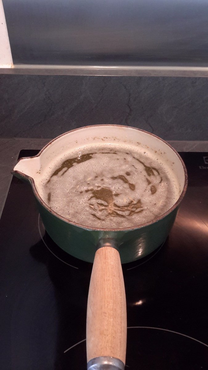 Rpphanna's tweet photo. Once your trim is in your butter it should start looking very green and herby. Make sure the heat is low! You will see white bubbles on top, that's fine. If it turns into froth/foam, then turn it down! Stir every 20 mins and simmer for 3 hours. #420Cooking #420 #Cannabutter https://t.co/J654UrSpAP