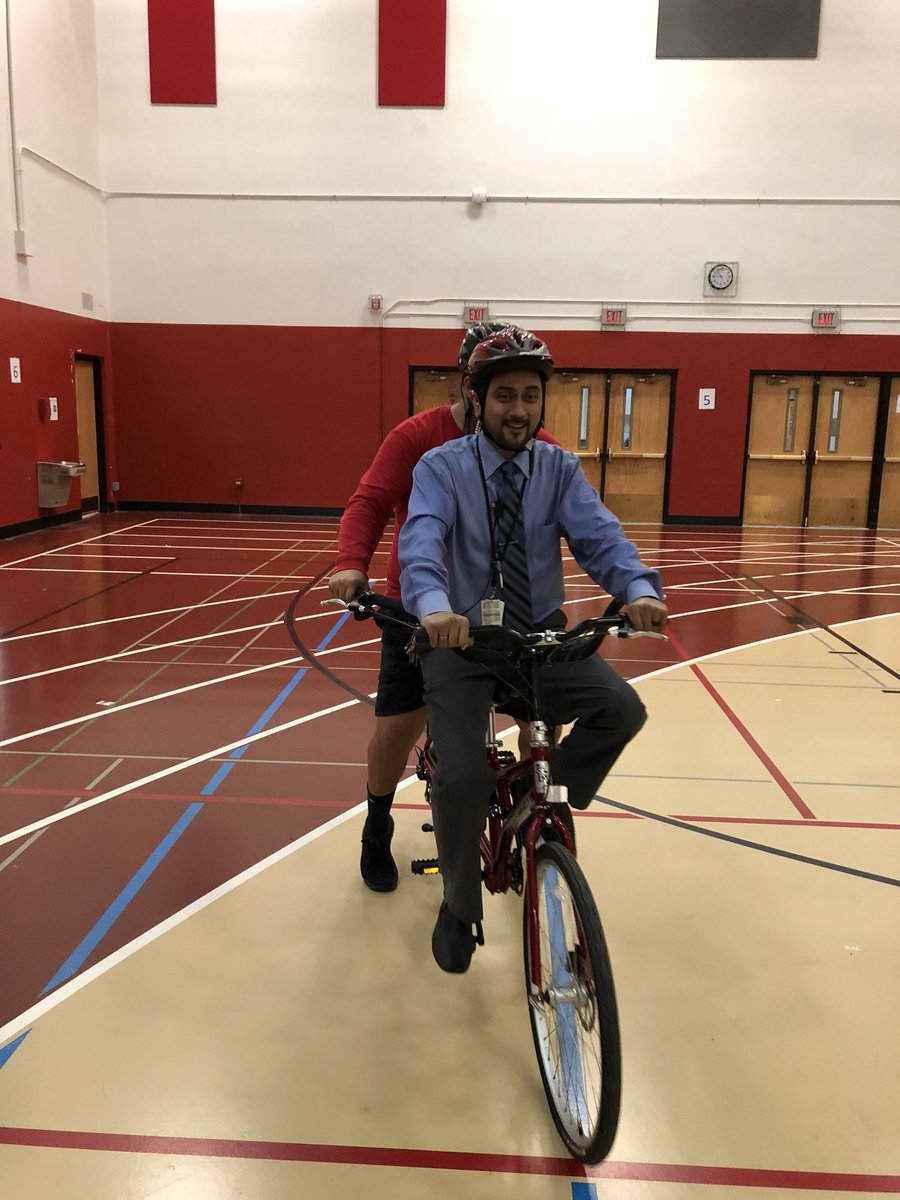 MrSeanMasten's tweet photo. @PrincipalKosak and Asst. Principal Mr. Nieto, join some of our students with bikes provided by #ProjectMobility https://t.co/PJNb1SO2hE