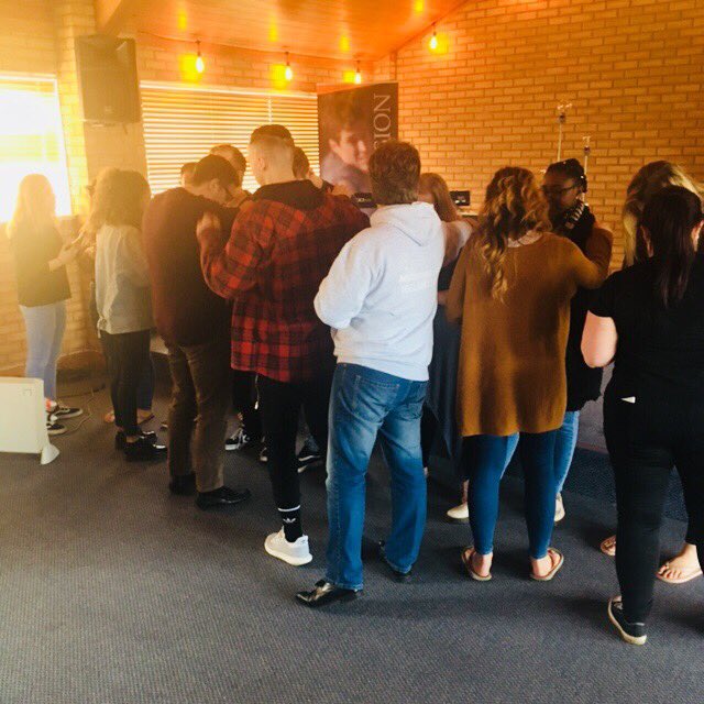 Students praying for one another as they go out on mission #matterseymissions2018