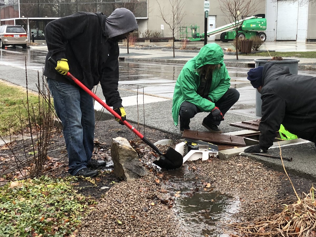 rocRMSC's tweet photo. Kudos to our @rocRMSC team members who are outside today checking on our green infrastructure. The weir they're clearing out measures and directs storm water from the pavement into our bioretention garden. #RMSCgreen #EarthWeek https://t.co/7WuhvX4mP7