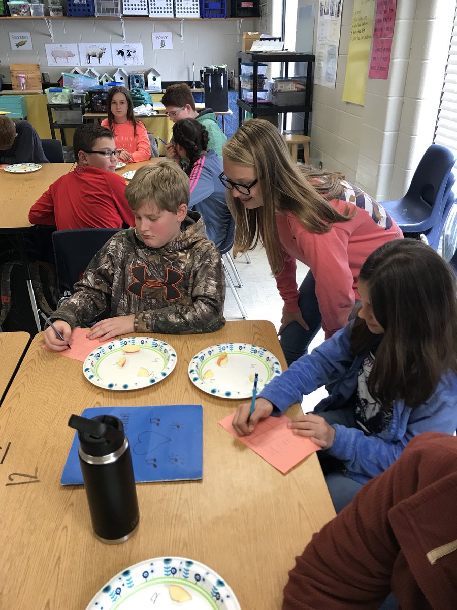 NHMS_FFA's tweet photo. 8th Grader, Haley Smith, conducts an Agriscience Taste Test with 6th graders. Students are taste testing 4 varieties of apples. https://t.co/KW300CfhRi
