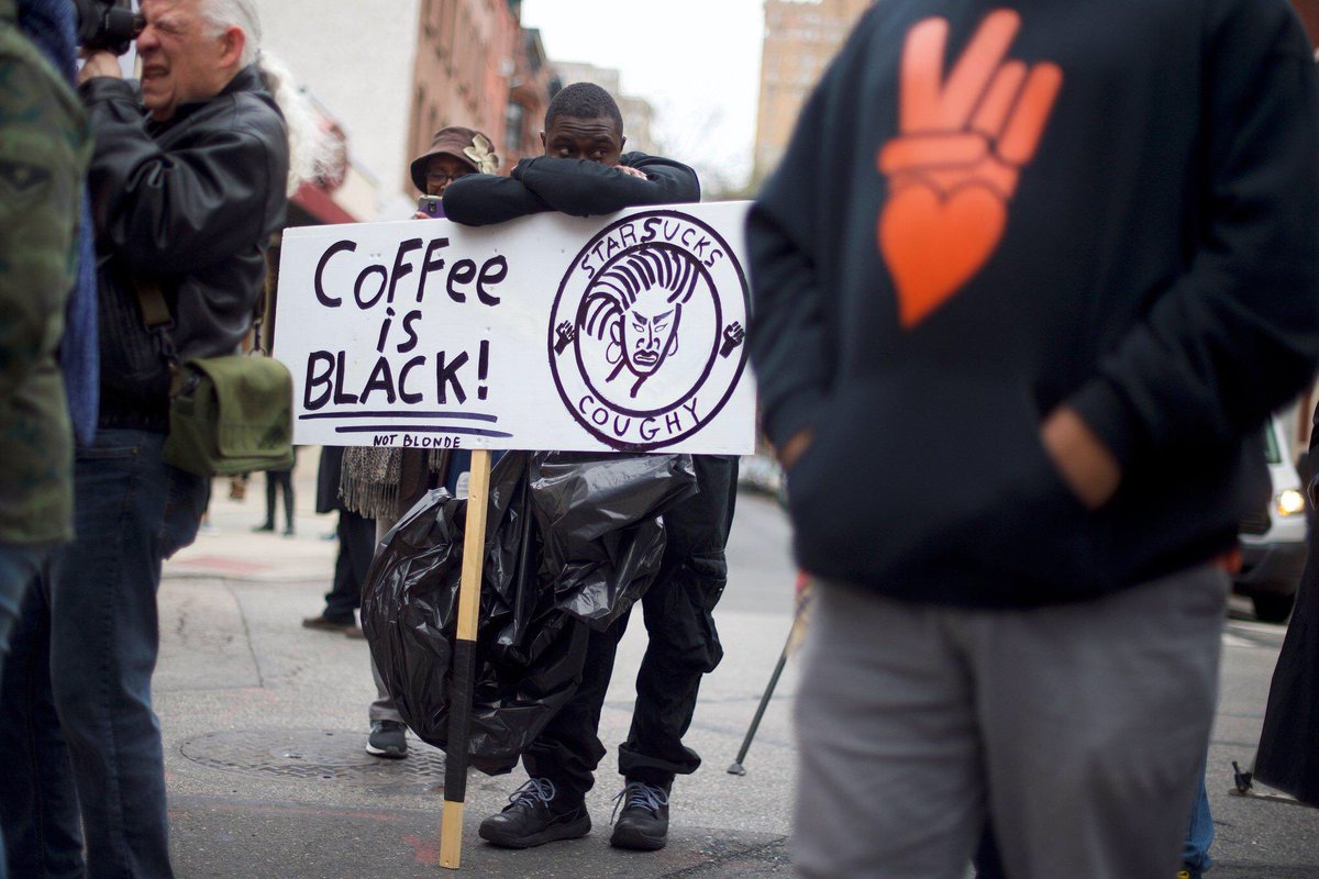 XharraArbana's tweet photo. A protester demonstrated on Sunday outside a #Starbucks in #Philadelphia, where the police arrested two black men who were sitting inside.CreditMark Makela/Getty Image @nytimes https://t.co/NwcssJQisK