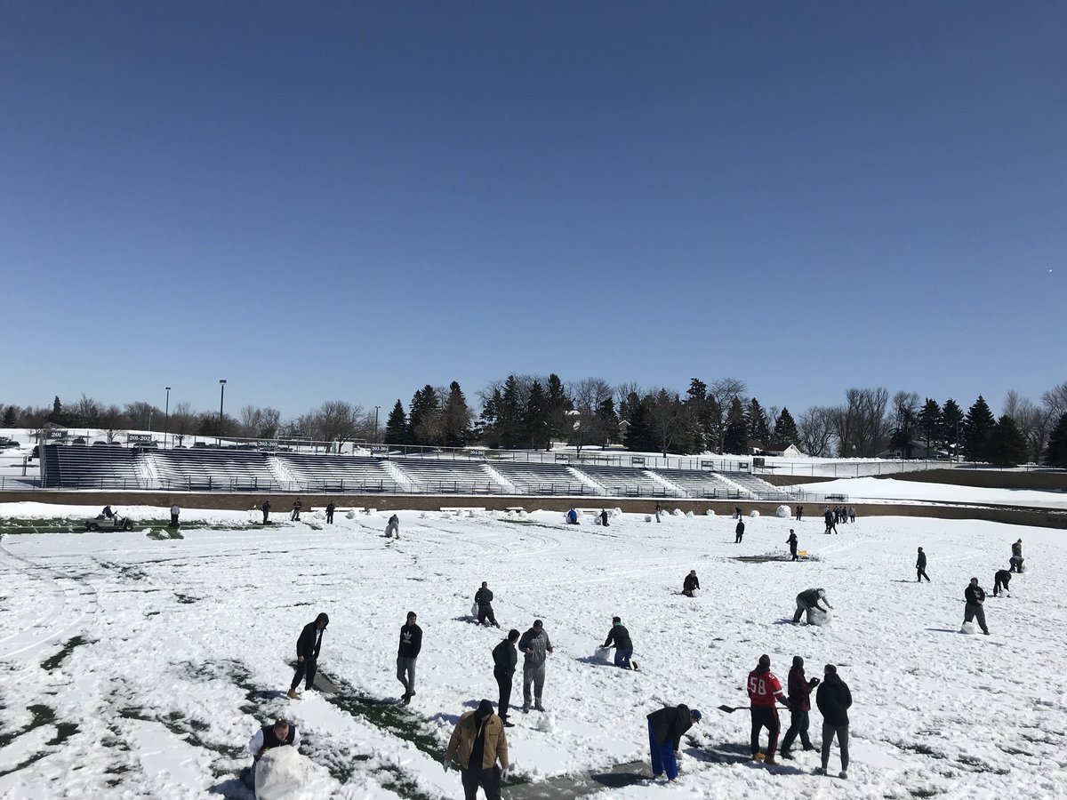 GoAugie's tweet photo. .@AugieFB out clearing the April snow from KO in order to get practice in this week | #WeAreAU | #EarnIt https://t.co/wDK6LWdoiV