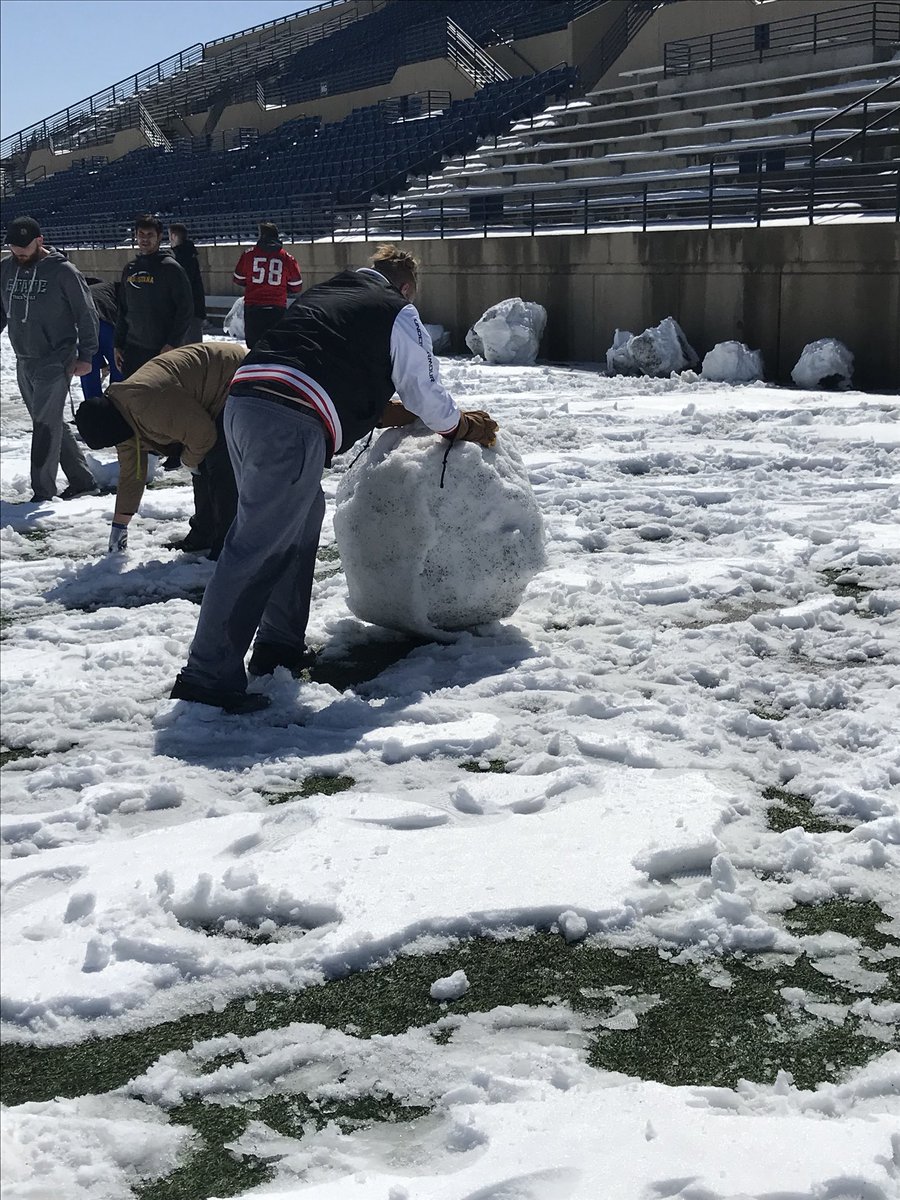 GoAugie's tweet photo. .@AugieFB out clearing the April snow from KO in order to get practice in this week | #WeAreAU | #EarnIt https://t.co/wDK6LWdoiV
