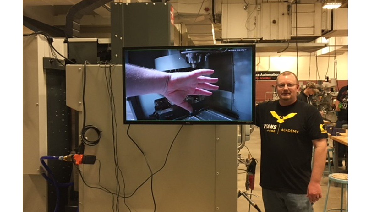 nacco15's tweet photo. Manufacturing Professor Todd Flessner @DanvilleAreaCC had a great idea to build "CNC TV" to keep track of the operations of the new CNC machines. While a student is doing metalwork on a CNC, the rest of the class can watch on the video screen. That's Prof. Flessner's hand inside. https://t.co/gYHpNsk3af