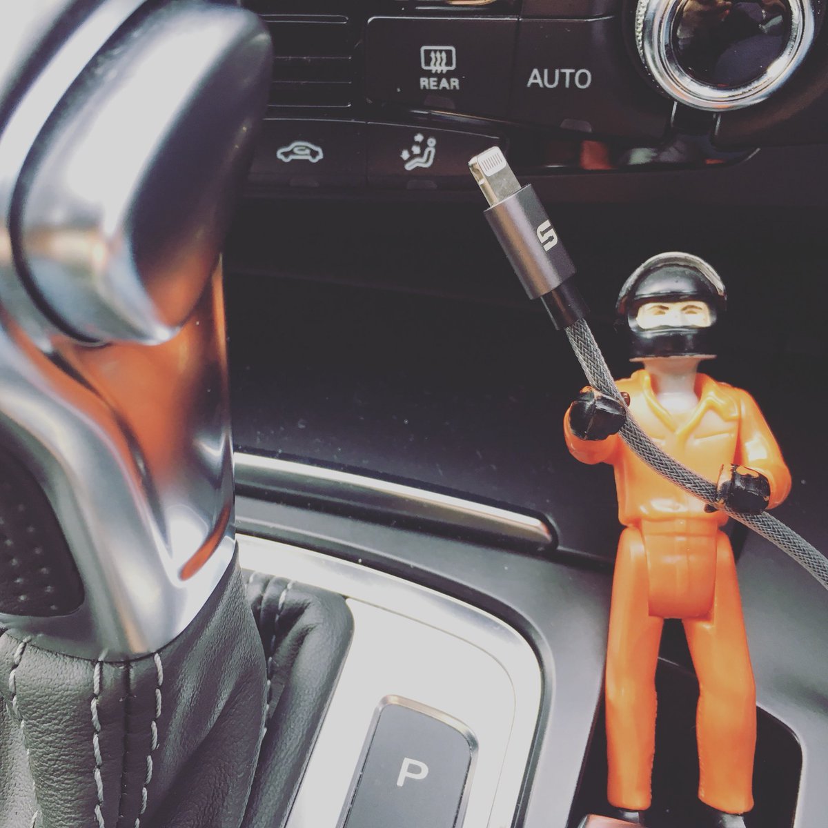 DarthBossk's tweet photo. Turns out old Fisher Price action figures make ideal in car cable holders. https://t.co/xqUYArOG4L