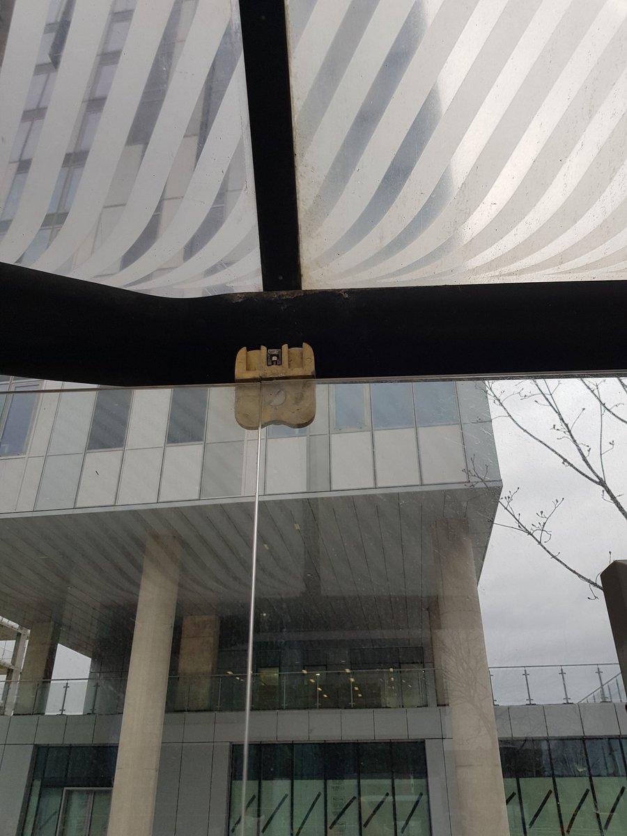TomD_1994's tweet photo. @MCRMetrolink a fitting seems to have broken at Harbour City Tram stop and the wind is moving the glass quite dramatically. A windy spot, please make sure it's safe! https://t.co/BpFRgnkriL