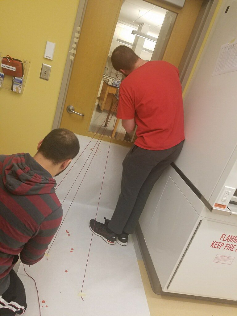SUForensics's tweet photo. Graduate students in Professor Seferyn's FSC 663 Bloodstain Pattern Analysis class use yarn to perform the string method. This will predict a general origin of the blood loss.
#SUForensics https://t.co/He0JjSWGCx