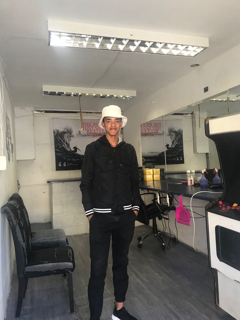 lalelaproject's tweet photo. Lalela Alumni Faisal started cutting hair in homes & bc of the creativity of his cuts, became very popular. He saved up to open this shop & plans to use the $ to study engineering! #ArtsEd Support students like Faisal, join our #ClassCampaign at https://t.co/kR1iRPa8j6! https://t.co/jsn93cxxHd