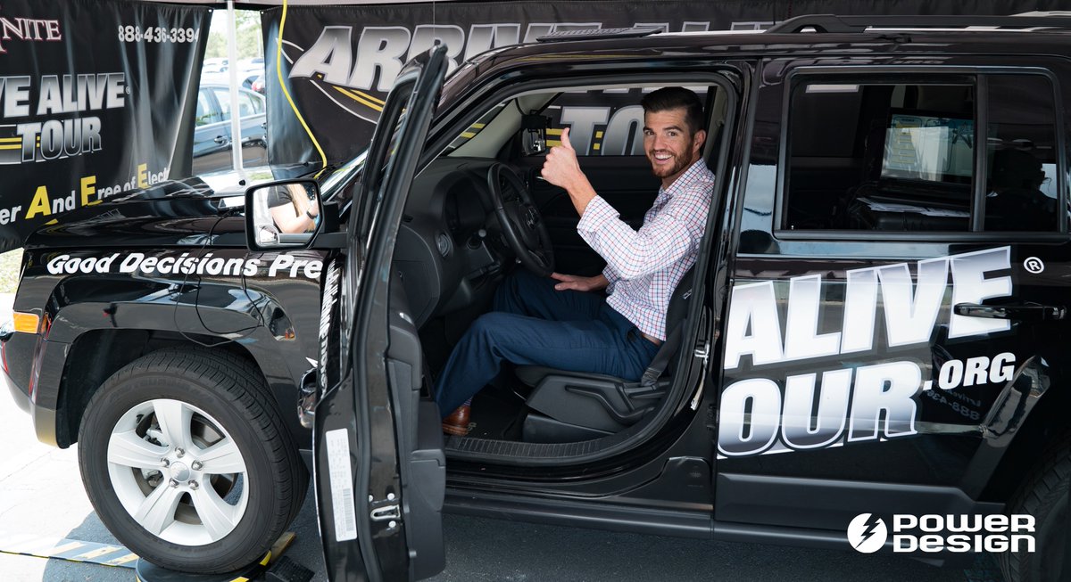 PowerDesignInc's tweet photo. We care about the safety of our employees ALL THE TIME, and during Distracted Driving Awareness Month, we want to drive the message home (literally). Employees got to experience UNITE's @arrivealivetour distracted driving simulator, right here on the GRID. #DecideToDrive https://t.co/GmhjzmhUjv