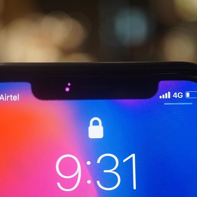 techpp's tweet photo. A tiny light goes on in the (in)famous notch of the iPhone X as the phone tries to identify a face. The joys of a super close up lens - don’t try to spot this with your bare eyes. 
#iPhoneX #iPhoneFaceID #FaceID #iPhoneNotch #PhoneNotch https://t.co/0iRFbcscxh https://t.co/wOLD6vQhY9