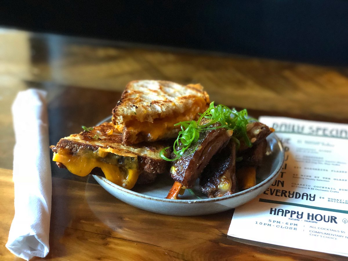 Another BIG BITE comin’ atcha! For the next two weeks we’ll be offering the Braaibroodjie (Bra-ee-bru-ee-kee). This South African barbeque sandwich is made with sharp cheddar, peach chutney, &amp; red onion. And let’s not forget the South African spice rubbed lamb ribs on the side!!