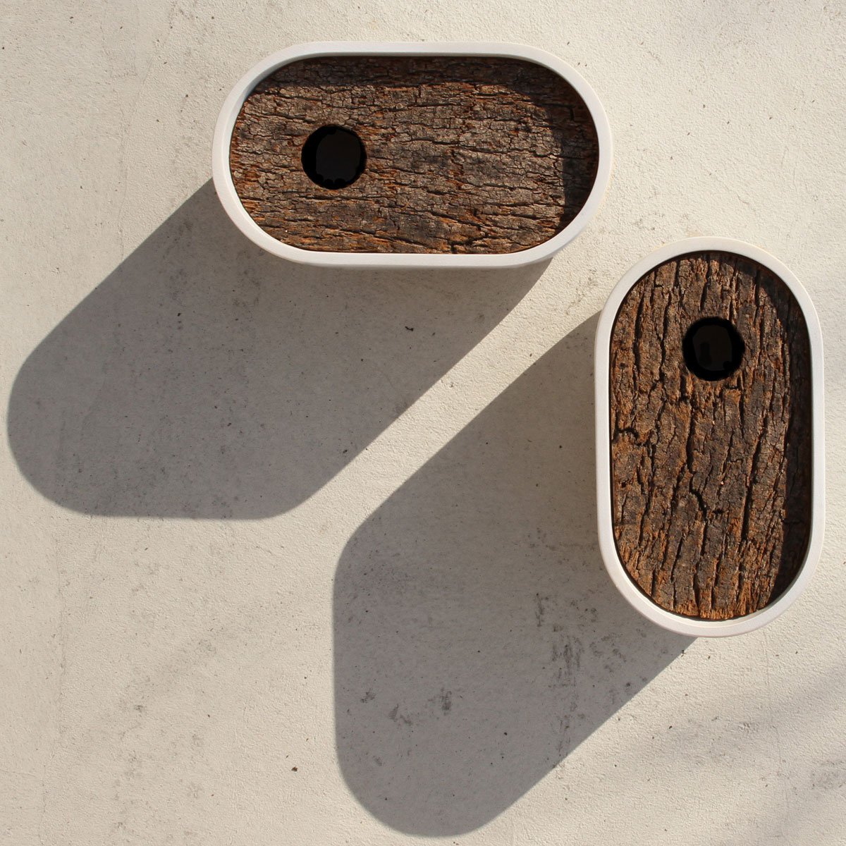 2021london's tweet photo. Encourage #birds into your #garden with the #HoleInn birdhouse designed by #AndreuCarulla. The two-piece nest box is made from white cast #concrete with a natural cork front, creating a modern and secure home for garden birds. >https://t.co/jMCeLqaNkw https://t.co/DOwNIKVj0E