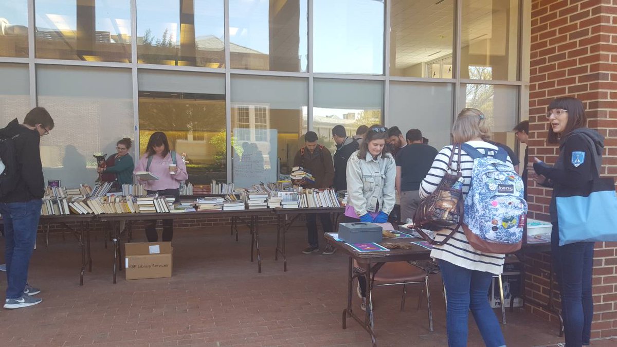 uncsdis's tweet photo. A little chilly today, but the entrance to Davis Library has bargain books from @scalaUNC, tasty treats from @uncilssa, and at the moment, a cute little dog named Beans. So grab a jacket and head on over. Today until 5pm. https://t.co/Z0IZOQq1jv