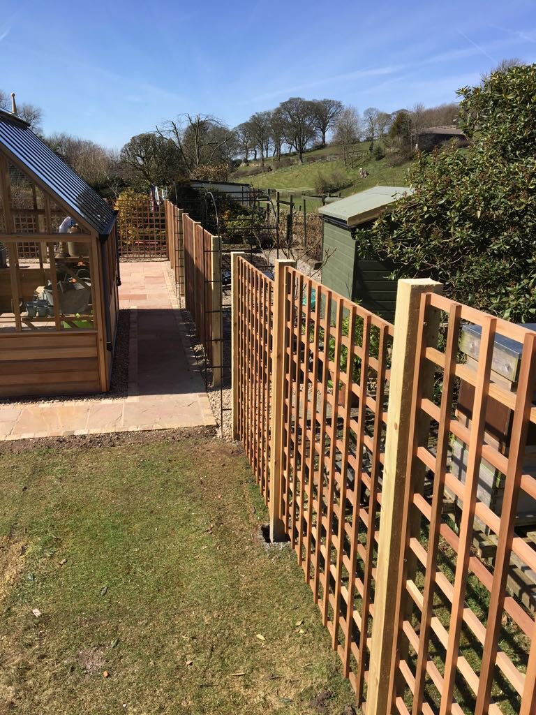 Greenhousebase's tweet photo. A beautiful greenhouse with a beautiful view! A perfect day to finish and photograph this project we designed with a @GabrielAsh11 Portico at the center of the project surrounded by paving, cedar wood trellis panels and custom built garden arches @allweldltd #GabrielAsh https://t.co/7pCDVOFwG8