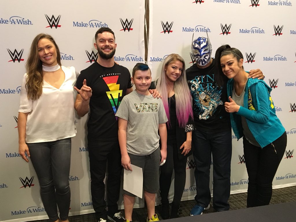 WWE's tweet photo. 35 @MakeAWish families in New Orleans for #WrestleMania got to meet @RondaRousey and a number of other WWE Superstars this afternoon during a private autograph signing: https://t.co/DKzczv5fKY