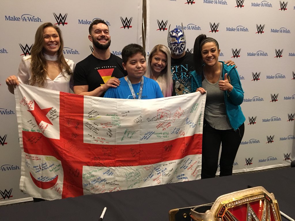 WWE's tweet photo. 35 @MakeAWish families in New Orleans for #WrestleMania got to meet @RondaRousey and a number of other WWE Superstars this afternoon during a private autograph signing: https://t.co/DKzczv5fKY