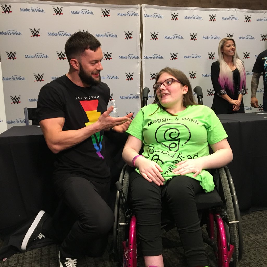 WWE's tweet photo. 35 @MakeAWish families in New Orleans for #WrestleMania got to meet @RondaRousey and a number of other WWE Superstars this afternoon during a private autograph signing: https://t.co/DKzczv5fKY