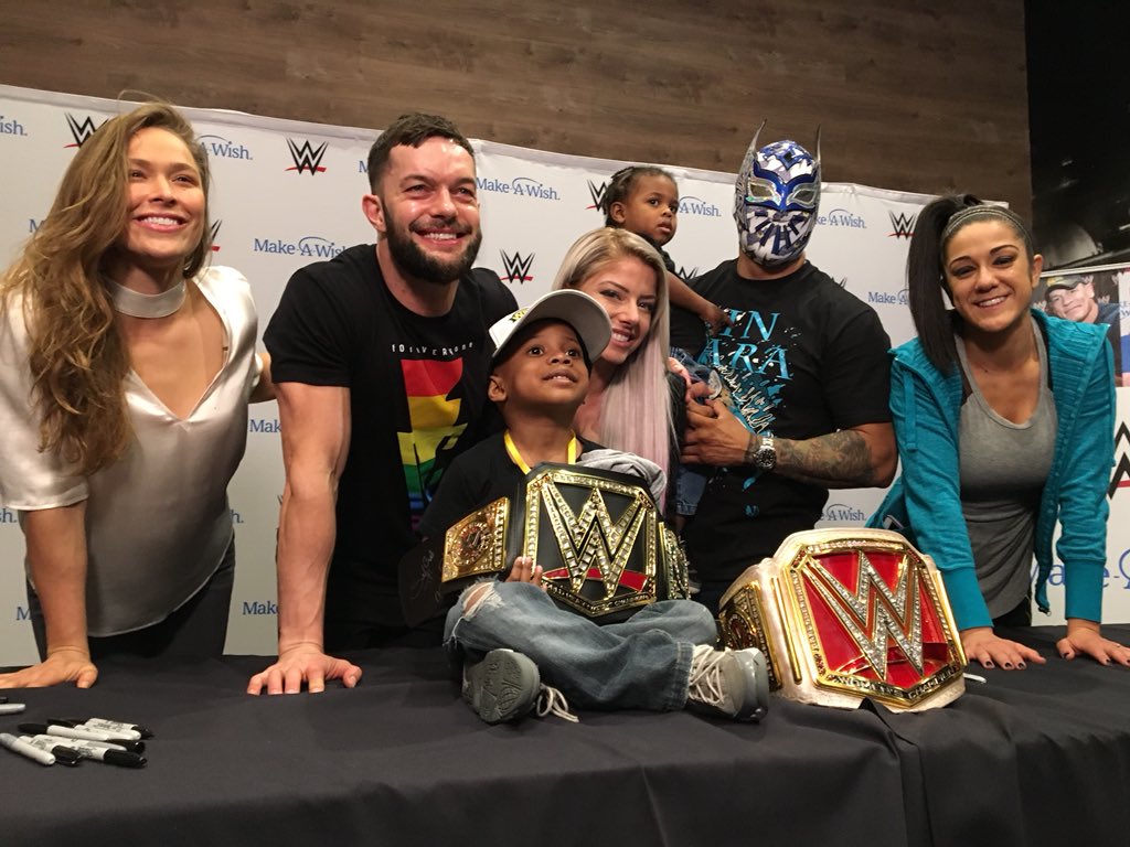 WWE's tweet photo. 35 @MakeAWish families in New Orleans for #WrestleMania got to meet @RondaRousey and a number of other WWE Superstars this afternoon during a private autograph signing: https://t.co/DKzczv5fKY