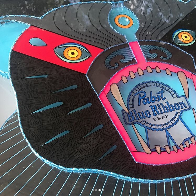PabstBlueRibbon's tweet photo. Check out this party animal by @sallykeyster titled "Blue Ribbon Bear." It's three layers of embroidered and painted glass.  In person the bear is literally popping out at you. It's her take on a mounted trophy head, animal friendly taxidermy! 🍺🐻#PBRart https://t.co/ohJhpXJOL3