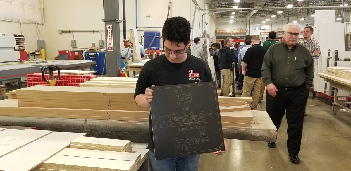 Former PWCS student hired by IBS last year. Created the sign for us as we watched.