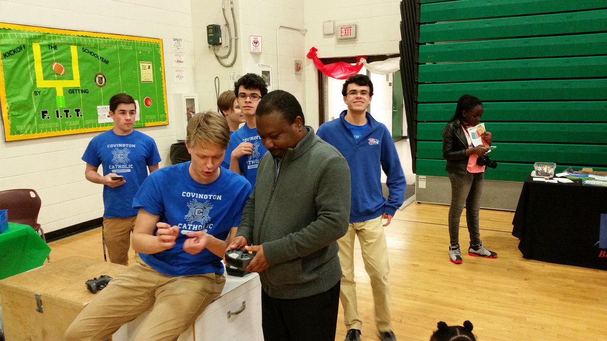 <a href="/CovCathColonels/">Cov Cath Colonels</a> senior Tyler McKNight teaching a dad at RAJones Middle School STEAM Carnival the finer points of driving a ClawBot <a href="/CovCathSTEM/">CovCathStem</a> <a href="/CovCathRobotics/">Cov Cath Robotics</a> <a href="/PLTWorg/">Project Lead The Way</a> <a href="/VEXRobotics/">VEX Robotics</a>