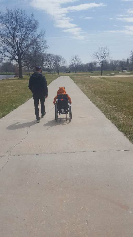 OmahaMGO's tweet photo. Coach @taylorsidz taking a walk with our @GoTeamIMPACT teammate at practice today. The kid is incredible!! #KaiStrong https://t.co/GZIN4hk0Hl