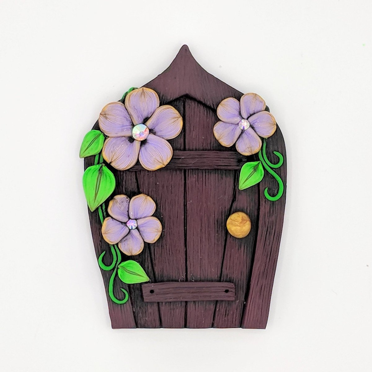 EMTippetts's tweet photo. The last of these gilded purple petals, now jn my #etsy shop: Cherry Wood #FairyDoor with Gilded Lavender Flowers and Leaves; #PixiePortal; #Hobbit Hole; #Gnome, #Elf; #FairyGarden Accessory #fairy #fae #handmade #polymerclay https://t.co/4zqDAeyyAX https://t.co/mEvNyhl1Tb